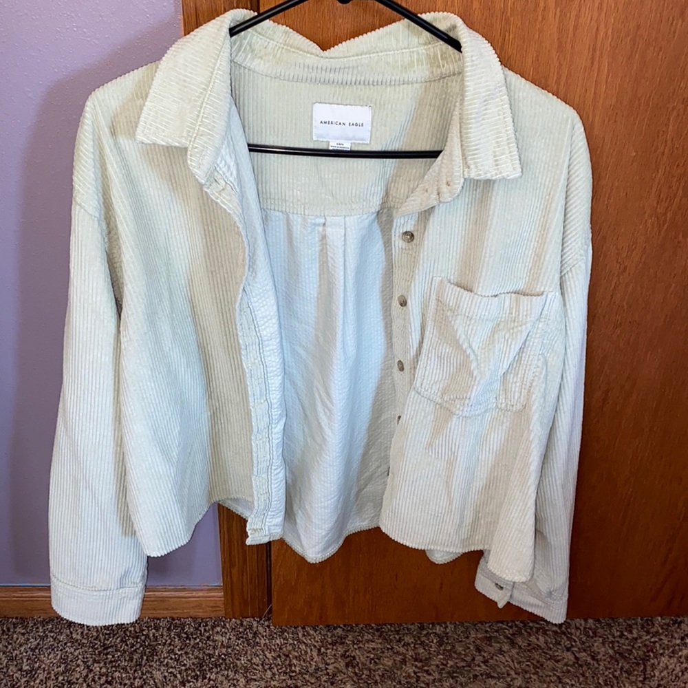 Light green corduroy button up shirt. Size L